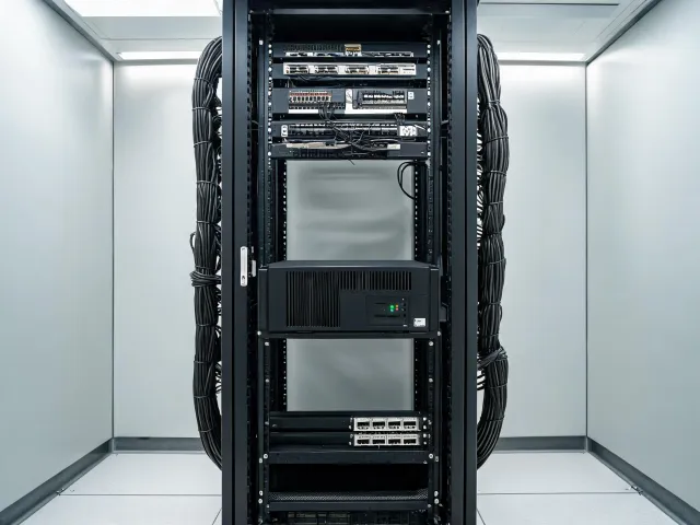 Rack UPS installed beside network equipment